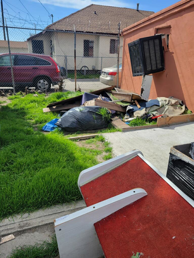 A large pile of general junk and debris outside a residential property for Duncan Hauling Services in Carson, CA.