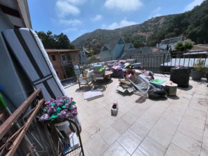 A rooftop patio filled with various items for junk removal by Precise Junk Removal in Bedford, OH