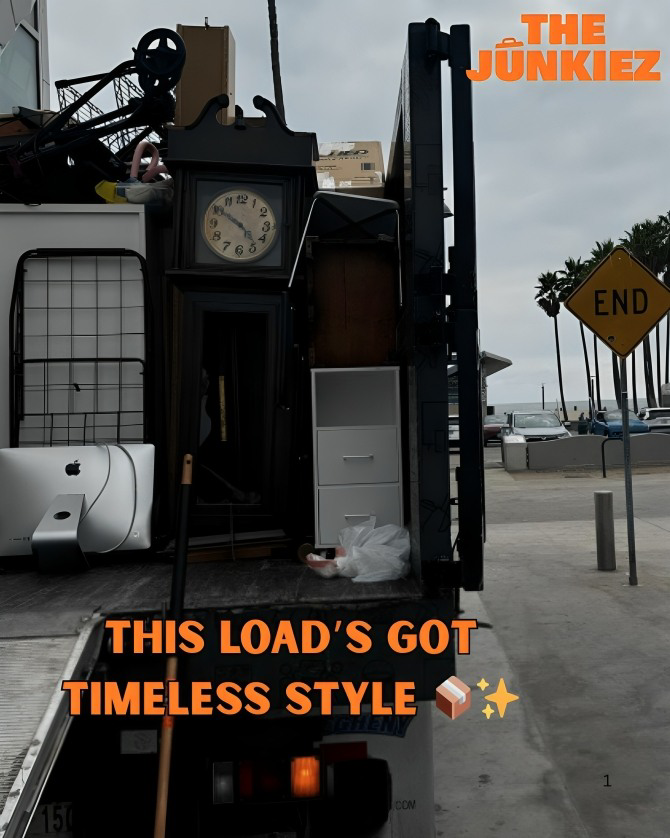 A Junkiez Junk Removal truck loaded with various items like furniture and electronics after a job in Los Angeles, CA.