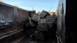 A truck bed filled with baled metal springs, ready for recycling by The Mattress Guy in Oakland, CA.