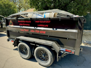 A Wasted Junk Removal trailer filled with household waste and debris after a junk removal job in Fresno, CA.