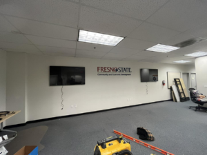 General contractor installing TVs and renovating an office space for Fresno Handyman in Fresno, CA.